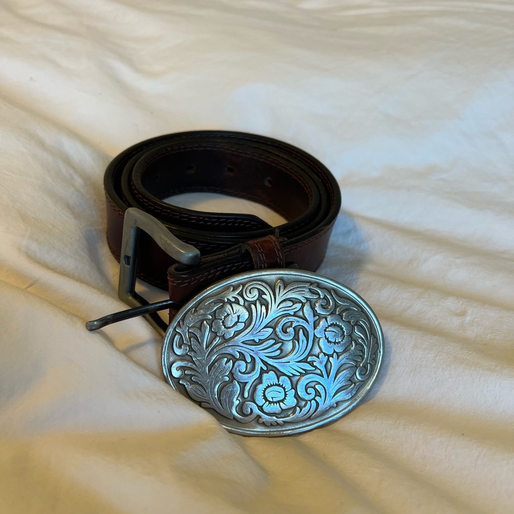 Leather belt with interchangeable pewter belt buckle.